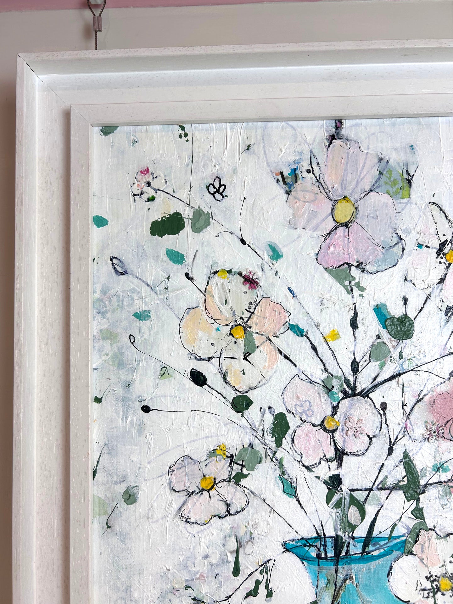 Delicate flowers in blue and pink vase